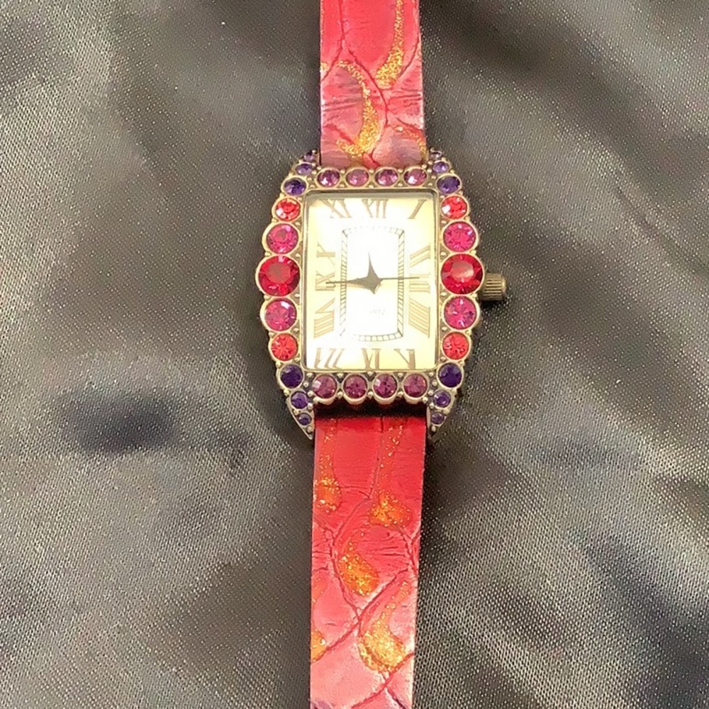 Heidi Daus watch. Pink,red,& purple Swarovski crystals with crocodile band